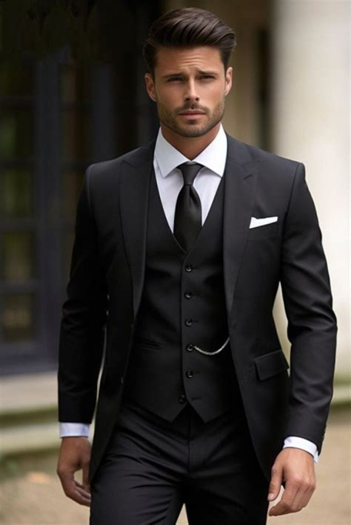 a black suit with a white shirt