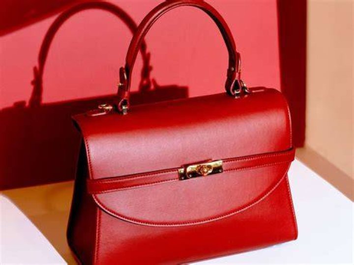 Bag, Handbag, Red, Fashion accessory, Bow tie, Pattern, Pink, Design, Font, Shoulder bag, 