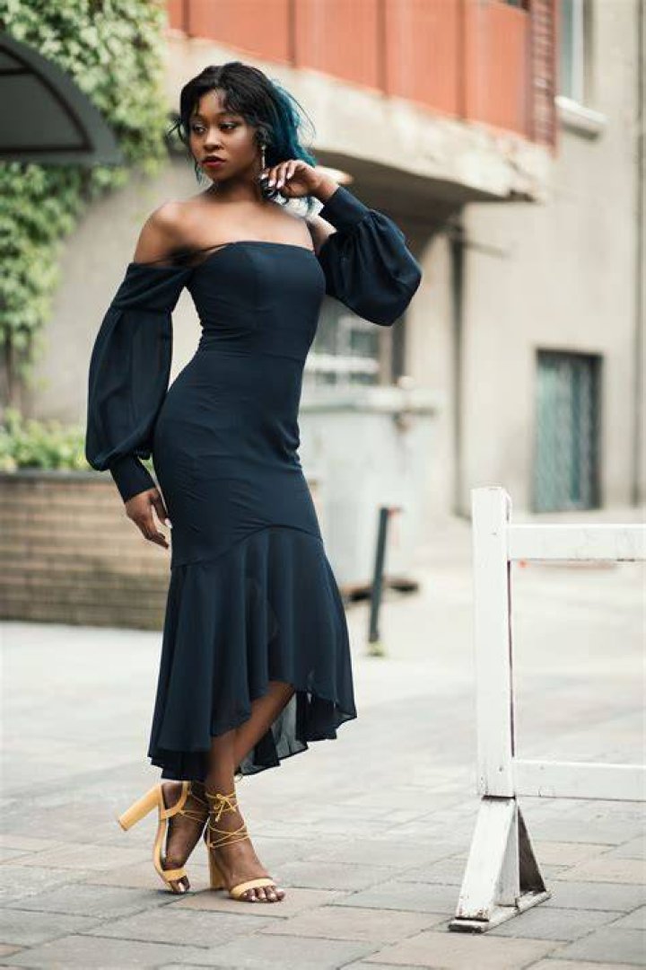 Clothing, Dress, Fashion model, Shoulder, Yellow, Cocktail dress, Joint, Strapless dress, Day dress, Neck, 