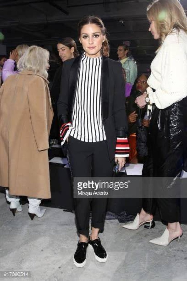 <p>Olivia Palermo attends the Tibi Autumn/Winter 2012 fashion show during New York Fashion Week wearing a Tibi peplum waist, striped, white cotton jacket with Mulberry stitched bow leather pumps, 12th Febraury 2012.</p>