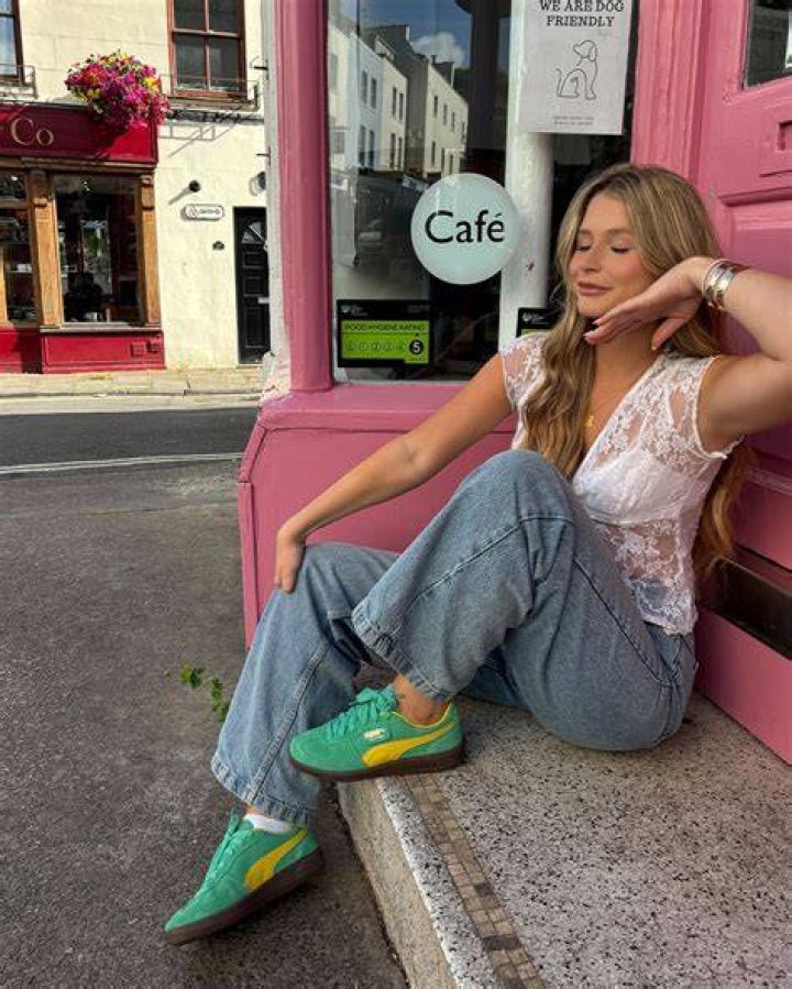 <p>Olivia Palermo wears a pair of high waisted masculine trousers with a <a href=">tangerine</a> jacket teamed with bright Kurt Gei