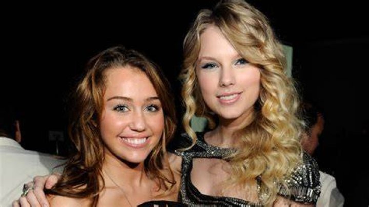 miley cyrus with taylor swift at the hannah montana movie premiere