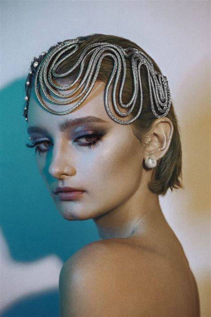 Style, Headpiece, Couch, Fashion accessory, Hair accessory, Headgear, Sitting, Vintage clothing, Living room, Embellishment, Style, Headpiece, Couch, Fashion accessory, Hair accessory, Headgear, Sitting, Vintage clothing, Living room, Embellishment,